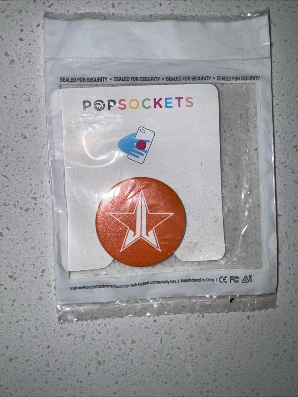 Jeffree Star Orange PopSocket with White Star Logo